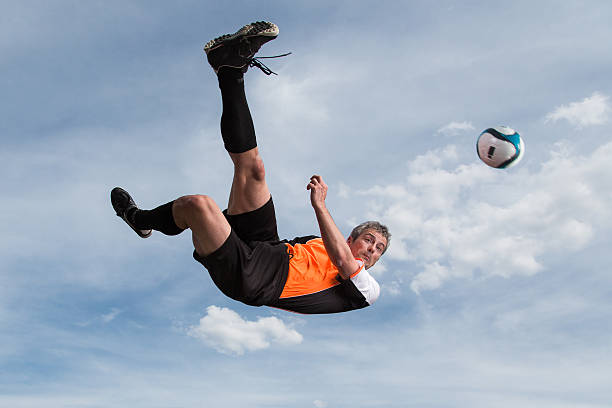 soccer player in a bicycle kick