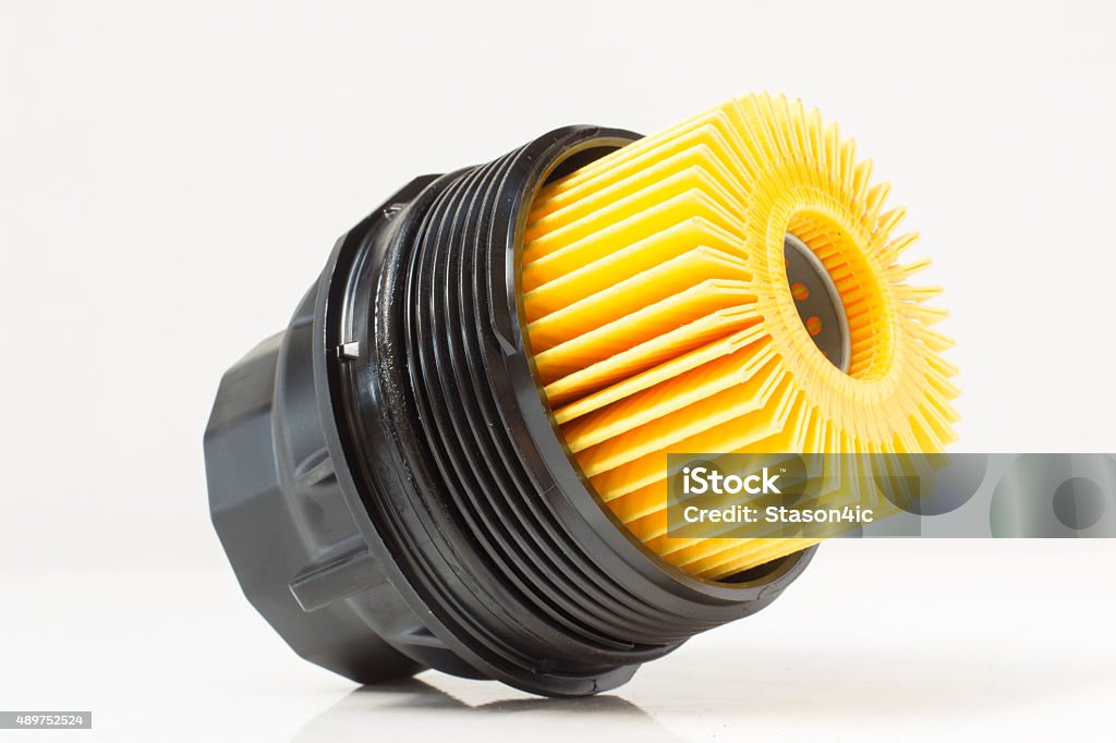 insert the engine oil filter with housing Fossil Fuel Stock Photo