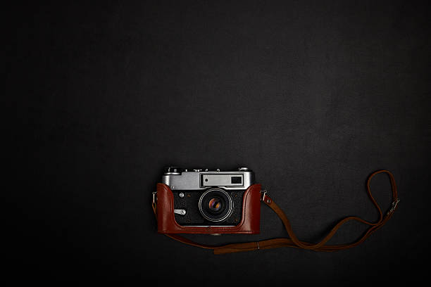 istock Vintage film camera on office table. Top view 489753134