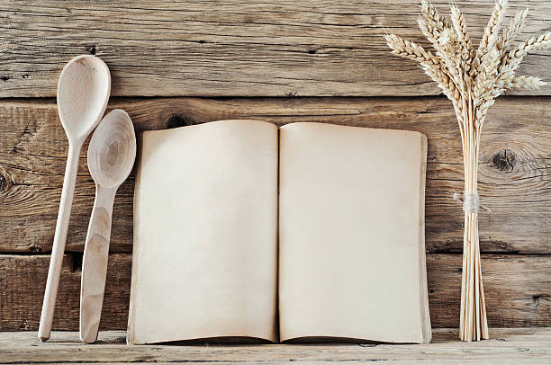 istock Kitchen book with blank pages on the wooden background 489754252