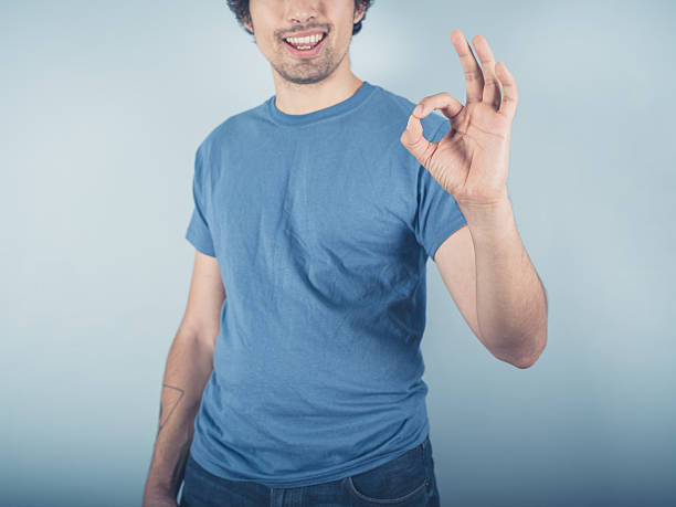 istock Happy young man showing ok sign 489754540