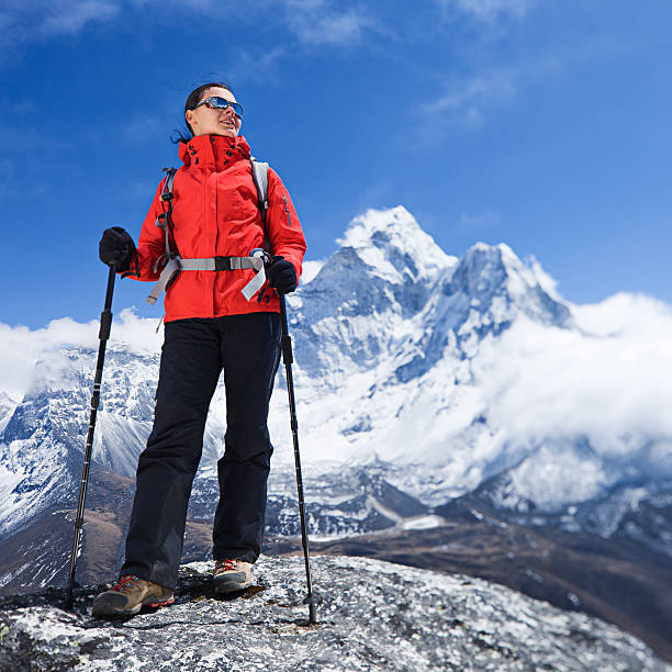istock Woman looking at view, Mount Ama Dablam on background 489755600