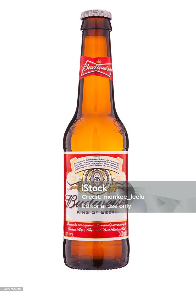 Budweiser bottle 300ml glass bottle Dublin, Ireland - April 25, 2014: An isolated bottle of Budweiser beer with the signature red and white label, which is distributed by Anheuser-Busch Inc. Budweiser Stock Photo