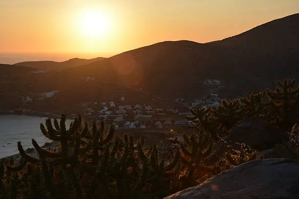 Sun setting behind the mountains. Taken from the main village of Ios, one of the cyclad islands of Greece. 