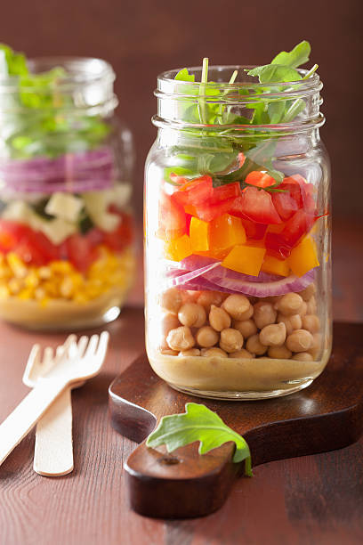 istock healthy vegetable chickpea salad in mason jar 489756236