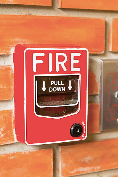 istock Fire Alarm Switch on the orange brick wall background texture. 489759090