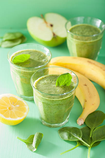 istock healthy green spinach smoothie with apple lemon banana 489759724