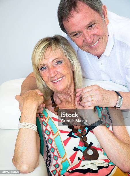Happy Senior Couple Posing Indoors Stock Photo - Download Image Now - 2015, 60-69 Years, 70-79 Years