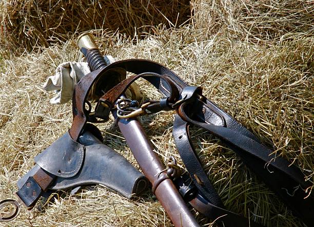 Confederate gear A sword, holster and web gear that may have be used by a confederate soldier. civil war enactment stock pictures, royalty-free photos & images