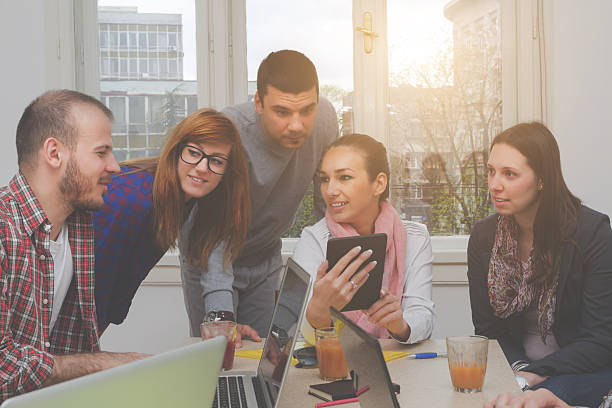 istock Young group of people discussing business plans 489765372