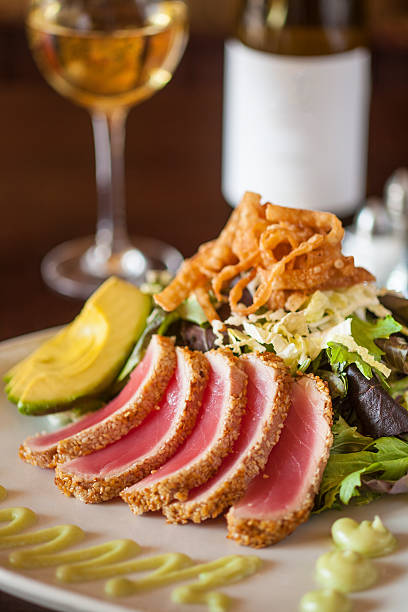 istock Sesame Crusted Seared Ahi with Baby Greens 489765452