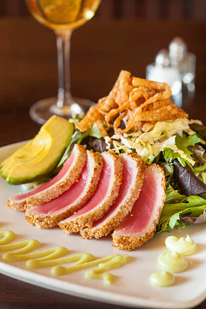 istock Sesame Crusted Seared Ahi with Baby Greens 489765470