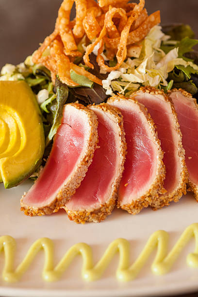 istock Sesame Crusted Seared Ahi with Baby Greens 489765486