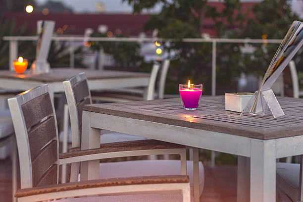 istock Candle on wooden table in a restaurant 489766354