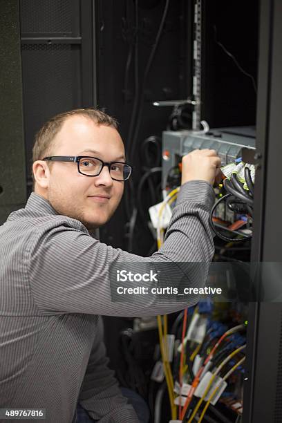 It Tech Working On Server Stock Photo - Download Image Now - 2015, Administrator, Adult