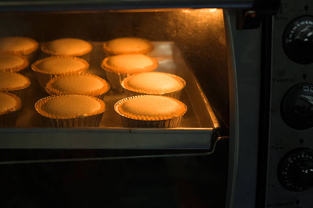 istock Baked cup cakes on a tray in the oven 489768216