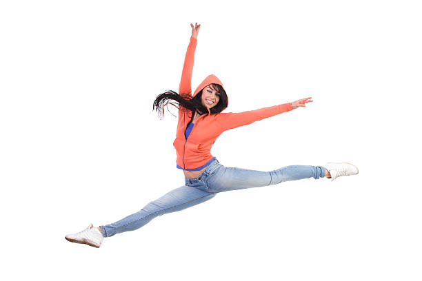 feliz feminina salto dividido - the splits ethnic women exercising imagens e fotografias de stock