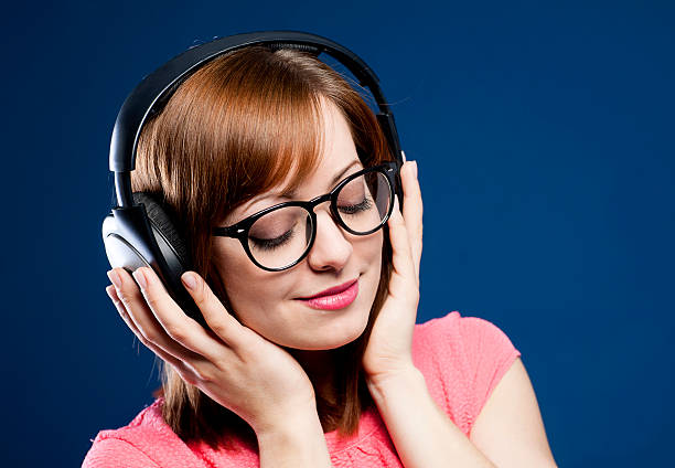 istock Young woman with headphones 489773249