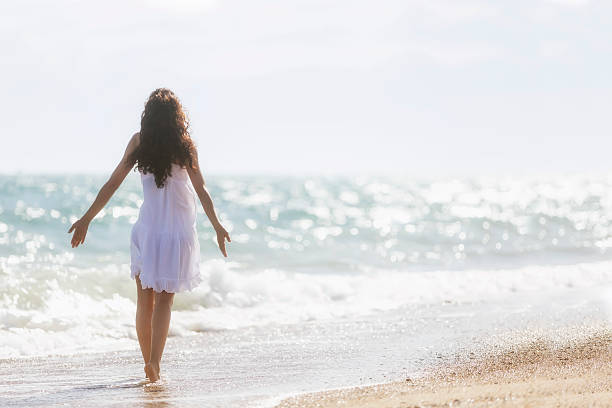 istock Happy girl on the beach 489773515