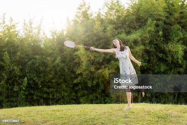 Woman Plays Badminton Against Summer City Park Stock Photo - Download Image Now - Active Lifestyle, Activity, Adult