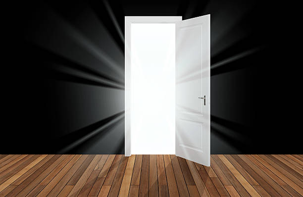 istock sunlight behind the opening door 489775957