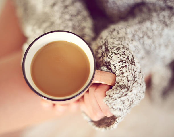 istock woman's hands holding a cup of coffee close-up 489776244