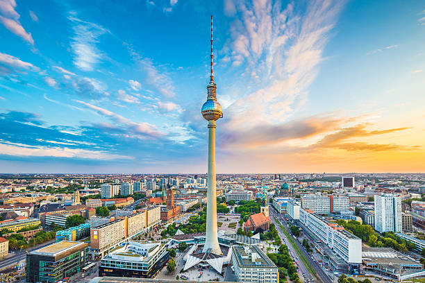 Berlin skyline panorama with TV tower at sunset, Germany Berlin skyline panorama with famous TV tower at Alexanderplatz and dramatic cloudscape at sunset, Germany. east germany photos stock pictures, royalty-free photos & images