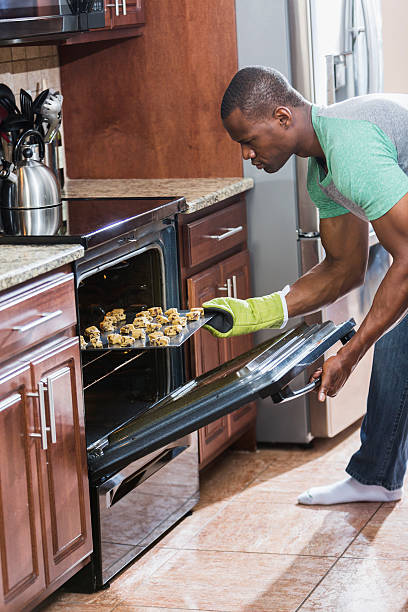 istock African American man baking cookies 489776392