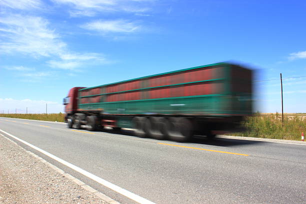 istock Blurry truck on road 489776632