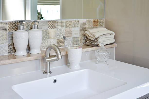 istock washbasin with faucet and liquid soap bottle at home 489780892