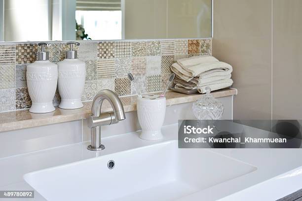 Washbasin With Faucet And Liquid Soap Bottle At Home Stock Photo - Download Image Now
