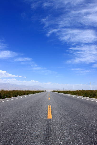 istock Asphalted road and the blue sky 489781190