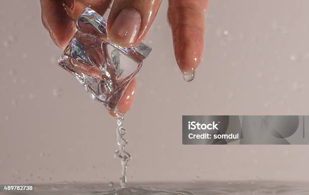 Picking Ice Cube Stock Photo - Download Image Now - 2015, Close-up, Extreme Close-Up
