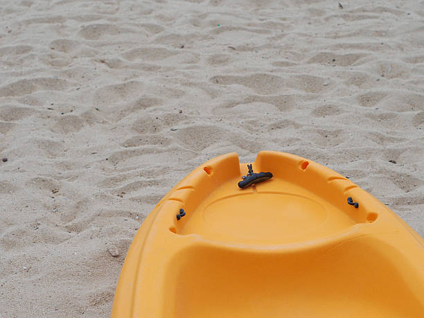 istock Yellow Kayak boat on the beach 489782816