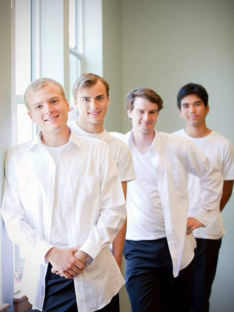 istock Young groom standing with groomsmen, getting ready for wedding 489782972