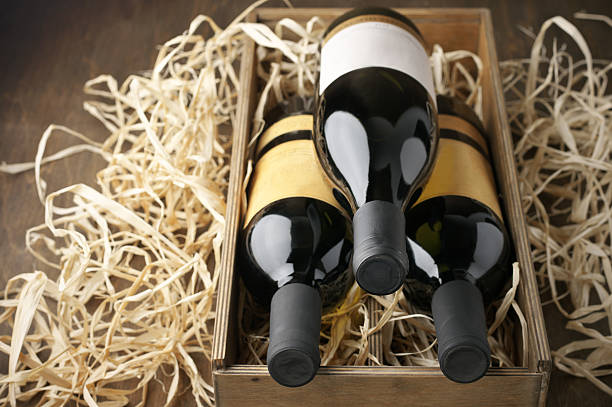 istock Wine bottles in wooden box and straw 489788184