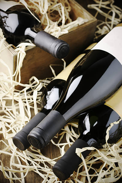 istock Wine bottles in wooden box and straw 489788216