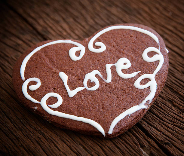 istock Heart cookie on wood background 489788258