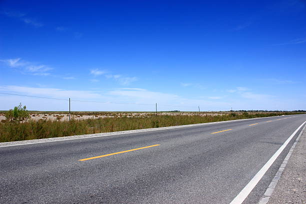 istock Asphalted road and the blue sky 489791142