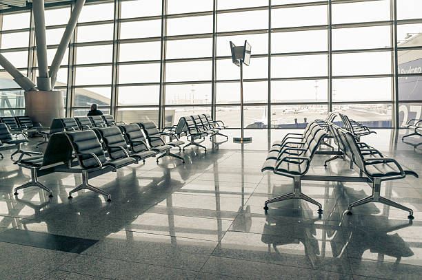 istock airport waiting area, seats and outside the window 489801100