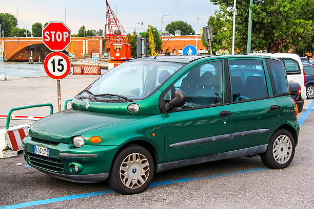 Fiat Multiple Venice, Italy - July 30, 2014: Motor car Fiat Multipla is parked at the city street. little fiat car stock pictures, royalty-free photos & images