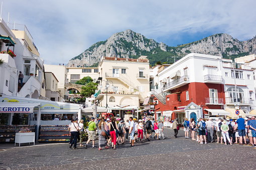 Capri, Italy - June 7, 2014: Capri Island Landscape, Marina Grande, many tourists walking around.