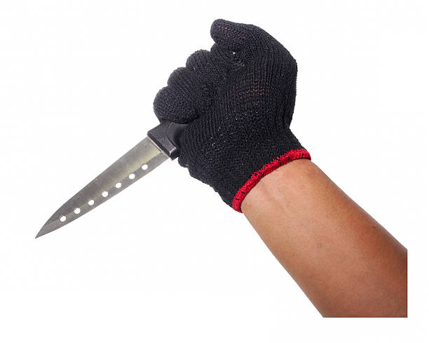 istock Hand with black glove holding knife 489802626