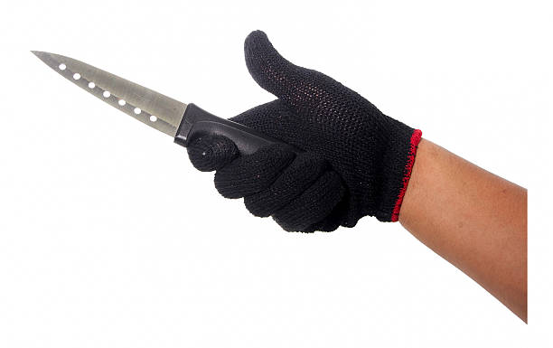 istock Hand with black glove holding knife 489803016