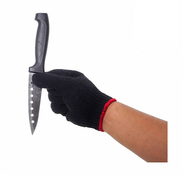 istock Hand with black glove holding knife 489803210