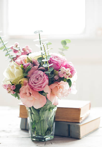 flowers and ancient books stock photo