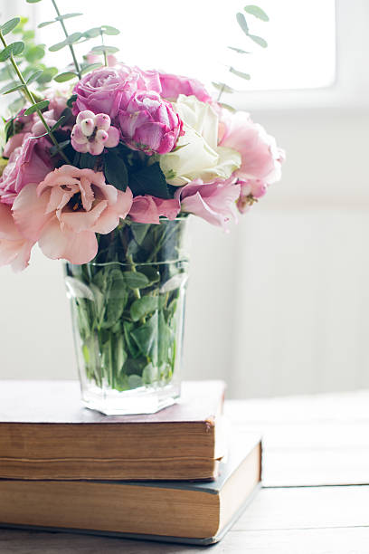 istock flowers and ancient books 489804060
