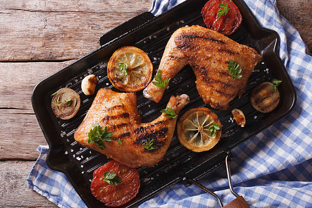 istock Chicken legs grilled on grill pan closeup horizontal top view 489804110