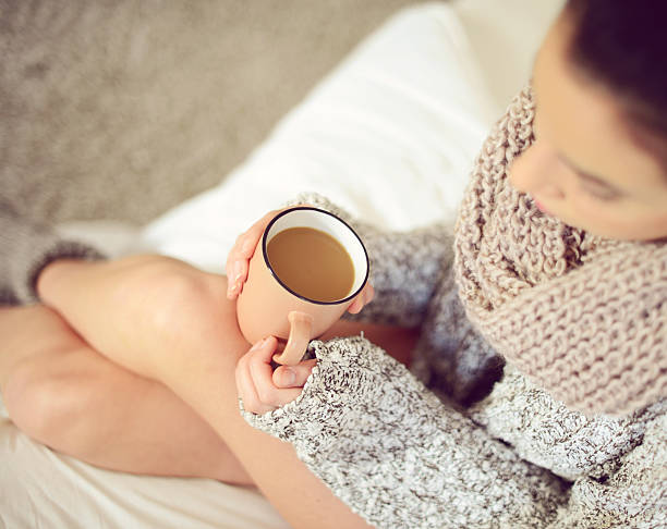 istock woman's hands holding a cup of coffee close-up 489804464