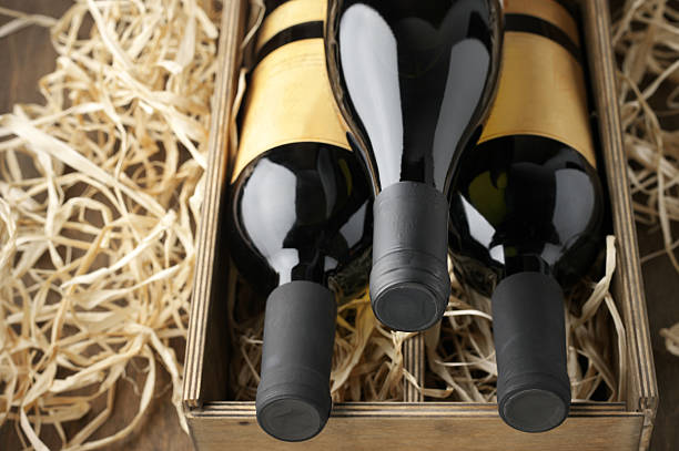 istock Wine bottles in wooden box and straw 489804942
